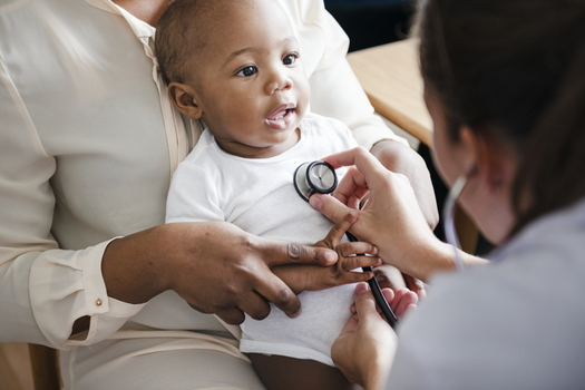 Doctor examining baby